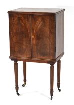 A late 18th/early 19th century mahogany, strung and partially crossbanded cabinet with two