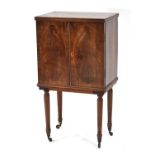 A late 18th/early 19th century mahogany, strung and partially crossbanded cabinet with two