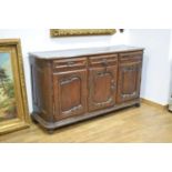 An 18th century and later oak dresser base or sideboard, the three drawers over three panelled