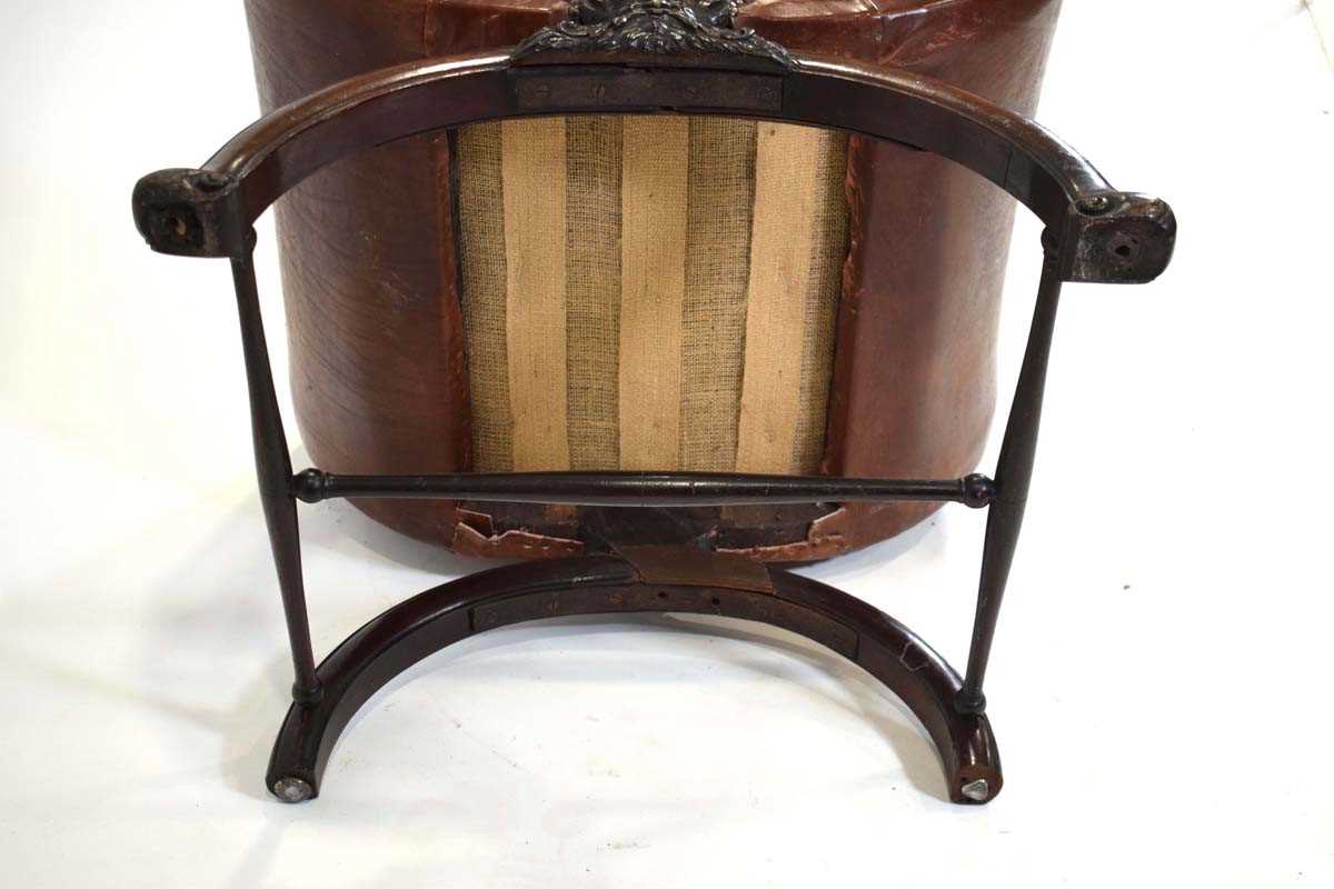 A 19th century mahogany and brown leather club armchair on a carved X-frame bearing a mask of a - Image 10 of 17