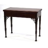 A Georgian mahogany and strung tea table with a later surface, the frieze with fretwork brackets, on