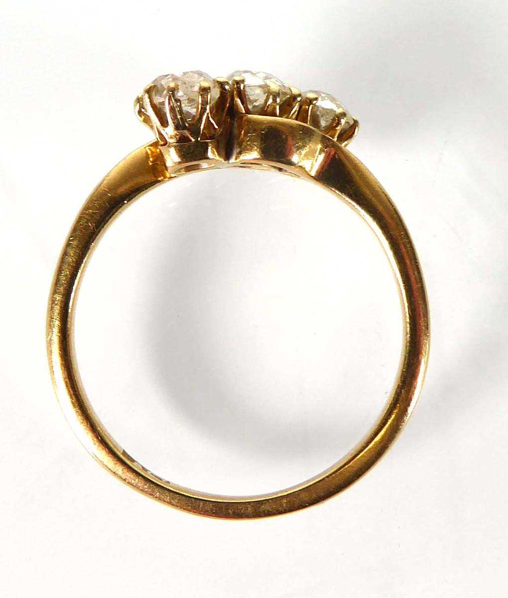 An 18ct yellow gold ring set three graduated old cut diamonds in a crossover setting,central stone - Image 4 of 4