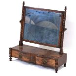 A mid-19th century mahogany toilet mirror, the rectangular plate on two turned supports over a