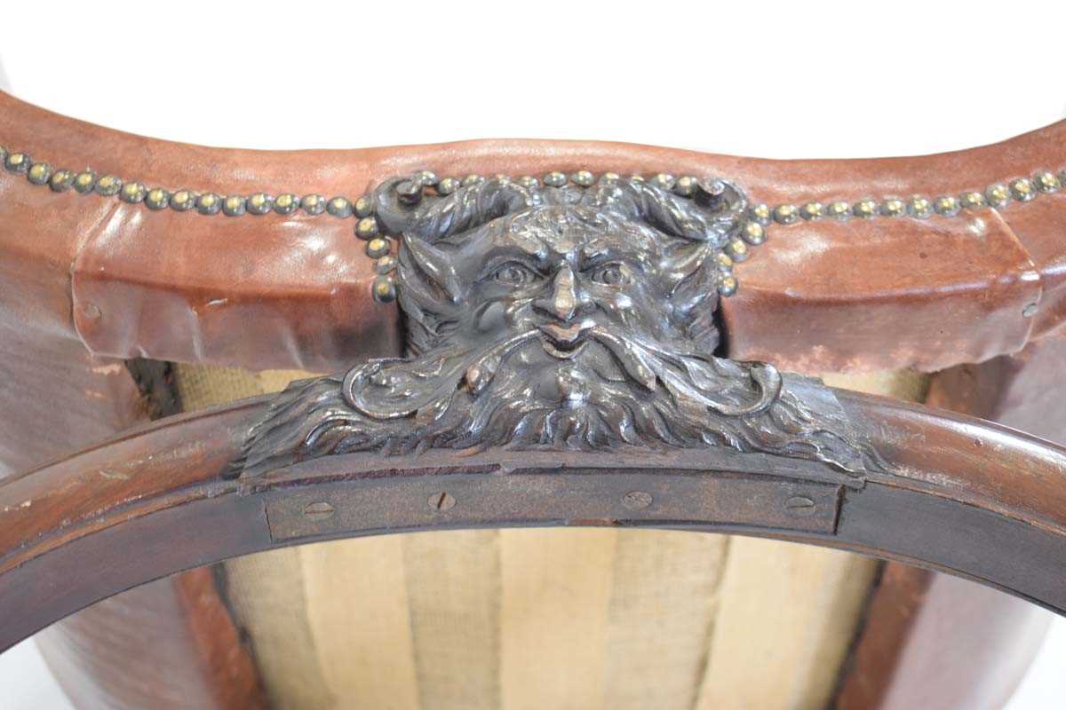 A 19th century mahogany and brown leather club armchair on a carved X-frame bearing a mask of a - Image 14 of 17