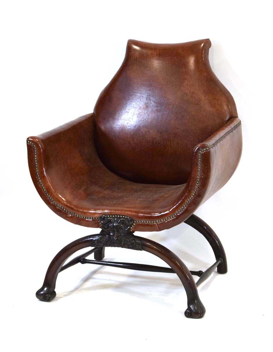 A 19th century mahogany and brown leather club armchair on a carved X-frame bearing a mask of a - Image 4 of 17