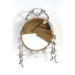 In the Art Nouveau manner: a silver-plated fire screen, converted to a mirror, h. 79 cm, plate d. 47