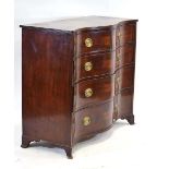 A 19th century serpentine chest of drawers in flame mahogany, two short over three long, with