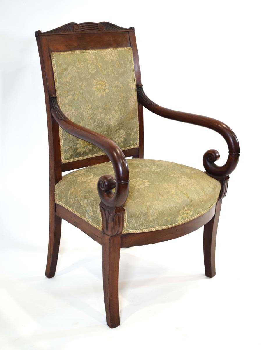 A 19th century Empire-style armchair, the mahogany frame with green floral seat and back, scrolled