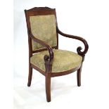 A 19th century Empire-style armchair, the mahogany frame with green floral seat and back, scrolled