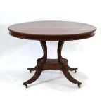 A 19th century mahogany circular breakfast table, the tilt-top with moulded edges and frieze, on