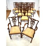 A set of twelve George III style mahogany dining chairs by Rackstraw, including a pair of carvers,