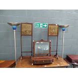 A pair of 19th century mahogany fire screens with embroidered panels and brass handles, on