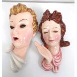 Two Royal Belvedere wall plaques, both modelled as a female beauty, max l. 29 cm (2)Fair hair: