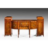 A 19th century mahogany, strung and crossbanded serpentine and breakfront sideboard, the kneehole