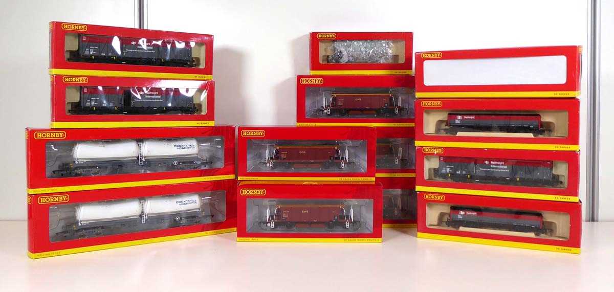 Fifteen items of Hornby OO gauge rolling stock including EWS hoppers, Railfreight wagons and others,