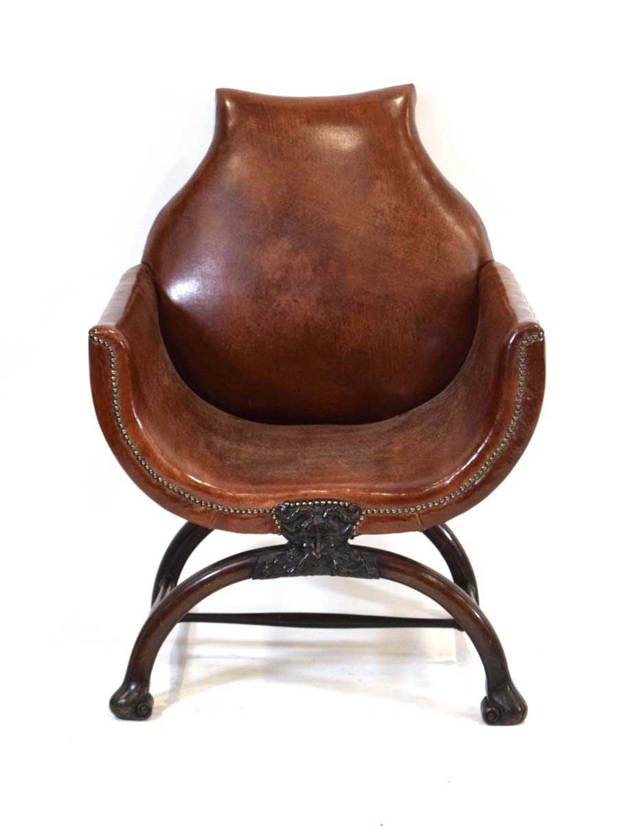 A 19th century mahogany and brown leather club armchair on a carved X-frame bearing a mask of a - Image 2 of 17