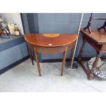 A 19th century mahogany and satinwood crossbanded demi-lune card table, the surface marquetry of