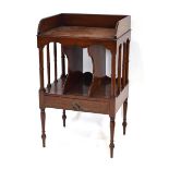 An Edwardian mahogany music cabinet, the gallery over a segmented centre and single drawer, on