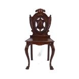 A Victorian mahogany armorial hall chair