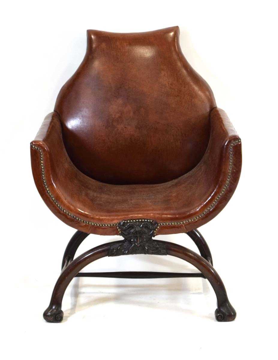 A 19th century mahogany and brown leather club armchair on a carved X-frame bearing a mask of a - Image 3 of 17