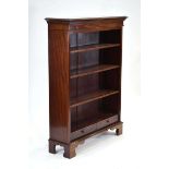 An early 20th century mahogany open bookcase with three adjustable shelves and two drawers on