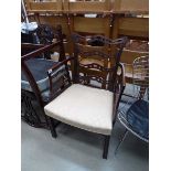 A Chippendale-style mahogany fretwork ladderback armchair with chamfered legs joined by a cross-