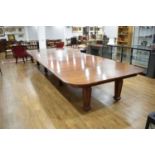 A mid-19th century mahogany extending dining table by Holland & Sons, the six leaves and D-ends