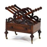 A Regency rosewood three-compartment canterbury with wreath mouldings, flame pediments, single