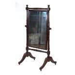 A 19th century mahogany-framed cheval swing mirror, the rectangular plate on two columns with four