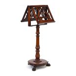 A mid-19th century mahogany duet stand with lyre decoration, turned column, platform base and