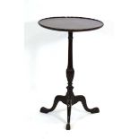 An 18th century style mahogany circular wine table on a turned column and tripod legs, d. 45 cm