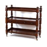 A Victorian mahogany buffet table, three tier with two drawers on reeded columns and castors, 120