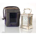 An early 20th century miniature carriage clock with a silvered and five-glass case of