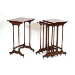 A set of early 20th century quartetto nesting occasional tables on slender column supports, max.
