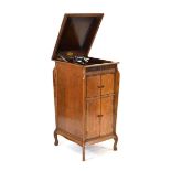 An early 20th century Gilbert & Co oak cased gramophone in cabinet with a concealed/integral horn
