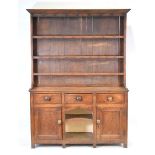 A 19th century Welsh oak dresser, Pembrokeshire/Cardiganshire, the plate rack with cast metal