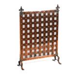 An Arts & Crafts style copper-finished fire screen with fleur-de-lis finialsHeight 66 cm. Rusting