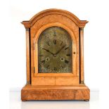 An early 20th century mantle clock, the movement striking on four chimes, the brass face with