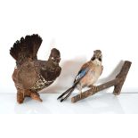 A taxidermy hazel grouse on a wall-mounted branch together with a wall-mounted jay (2)