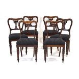 A set of six Victorian rosewood dining chairs on turned front legs with drop-in seats
