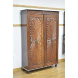 A 19th century and later Anglo-Indian rosewood cupboard, the two doors with decorative mouldings