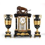 A late 19th century French mantel clock and garnitures, the enamelled face with Roman numerals,