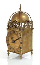 A lantern timepiece with a French movement and a typical brass case, h. 31 cm With winder.
