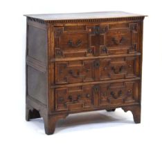 An 18th century and later two-section chest, the three drawers with geometric mouldings below a