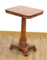 A 19th century mahogany occasional table with a decorative frieze, turned column, platform base