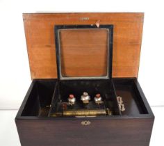 A late 19th century cylinder music box, playing on eight airs, with three bells stuck by enamelled