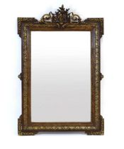 A 19th century scumbled and gilt highlighted wall mirror, the foliate frame surmounted by an urn