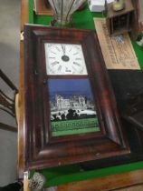 An American thirty-hour drop-dial wall clock by Brewster & Co., the enamelled face with Roman