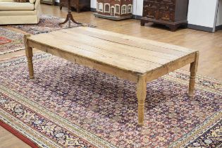 An early 20th century stripped and slatted coffee table converted from a daybed / opium bed, of