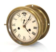 A Seth Thomas ship's bulkhead clock with a painted face and brass case, di. 18 cm Lacking glass,